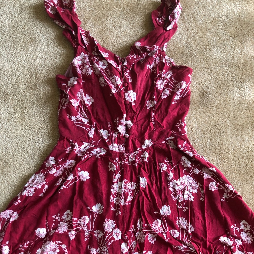 Beautiful burgundy romper with ruffled trim